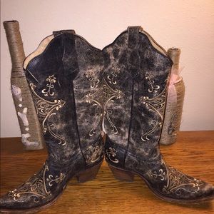Distressed leather cowboy boots.